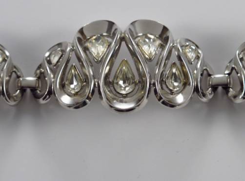 Trifari vintage bracelet rhinestones on rodium plate scroll pattern, 1950`s ca, American